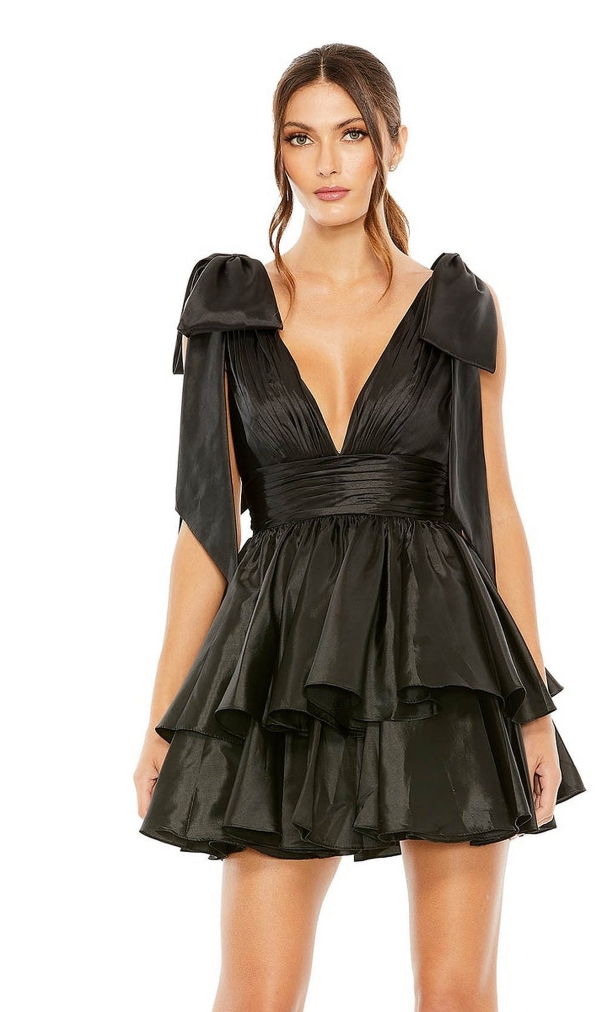A woman poses against a white background in the Mac Duggal 11657 Bow Short Ruffled Hoco Dress—a black, sleeveless dress with a deep V-neck and layered ruffle skirt—making it a stunning choice for homecoming.